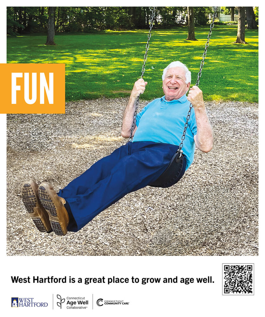 Kevin swings on a set of swings in a West Hartford park